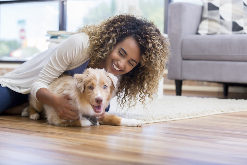 Young woman training puppy